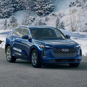 Front view of an Audi Q5 in a snowy environment.